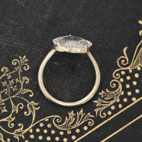 Side view of romantic 18kt yellow gold rose cut diamond solitaire, heart-pear shape.
