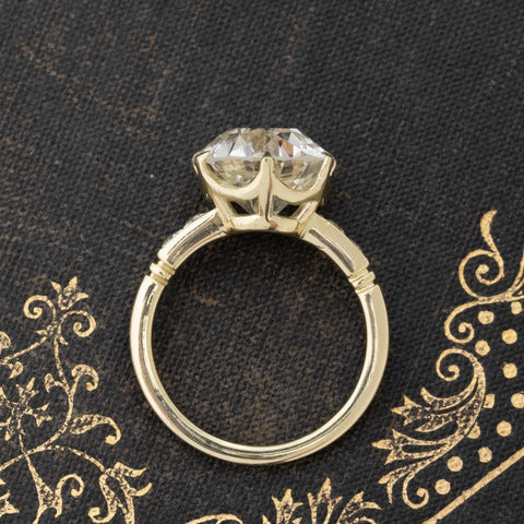 Side view of 5ct transitional diamond engagement ring with single cut side stones.
