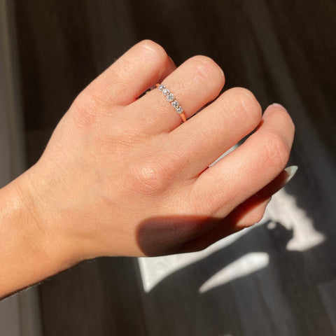 Elegant .53ctw Old Mine Cut Diamond Shared Prong Band, romantic design with Old Mine Cut Diamonds, Earth-mined diamonds in rose gold shown on ring finger.