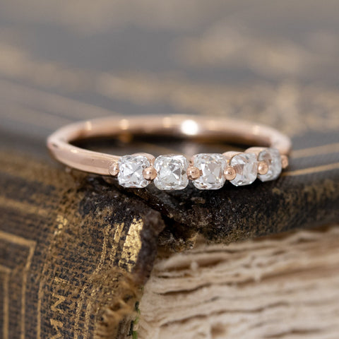Close-up of .53ctw Old Mine Cut Diamond Shared Prong Band, vintage-inspired band with Old Mine Cut Diamonds, crafted in rose gold.