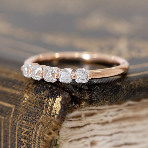 Antique lovers’ .53ctw Old Mine Cut Diamond Shared Prong Band in rose gold, featuring rare Earth-mined Old Mine Cut Diamonds.