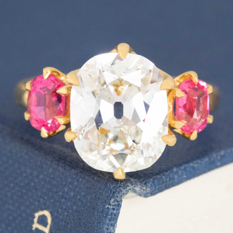 5.47ctw Old Mine Cut Diamond and Spinel trilogy ring in 22kt yellow gold.