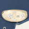 .57ctw Mixed Cut Diamond Bombe Ring with mixed cut diamonds set in a random pattern, resting on a blue textured surface. Antique-inspired one-of-a-kind wedding band.