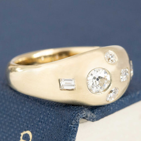 Close-up of .57ctw Mixed Cut Diamond Bombe Ring, vintage-inspired band with Antique Diamonds, crafted in yellow gold.