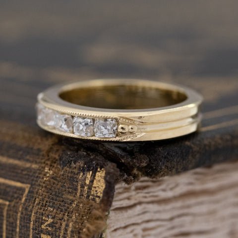 Antique lovers’ .58ctw Channel Set Old Mine Cut Diamond Band in yellow gold, featuring rare Earth-mined Old Mine Cut Diamonds.