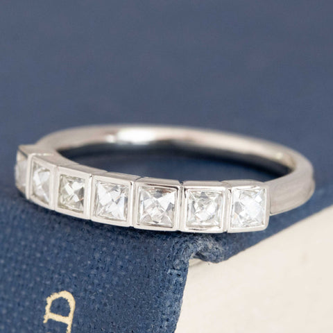 Antique lovers’ .58ctw French Cut Diamond Half-Hoop Bezel Band in platinum, featuring rare Earth-mined French Cut Diamonds.