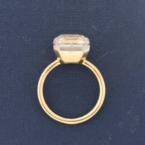 Side view of Vintage Asscher cut diamond ring in modern yellow gold collet.