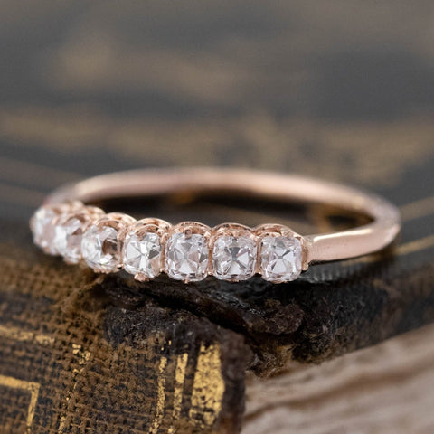 Close-up of .60ctw Petite Old Mine Cut 7-Stone Diamond Band, vintage-inspired band with Old Mine Cut Diamonds, crafted in rose gold.