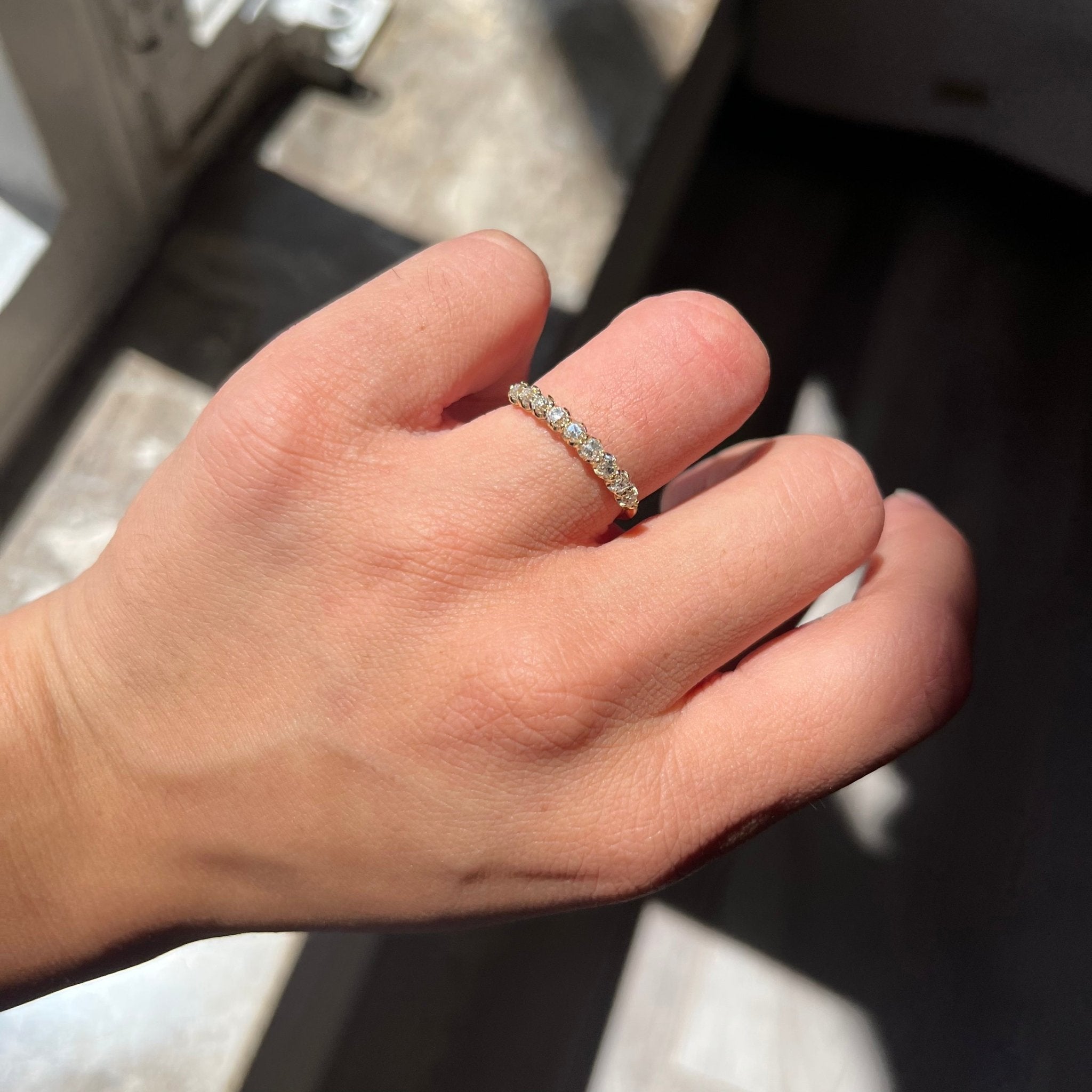 Elegant .61ctw Petite Old Mine Cut Diamond Half-Hoop Band, romantic design with Old Mine Cut Diamonds, Earth-mined diamonds in yellow gold shown on ring finger