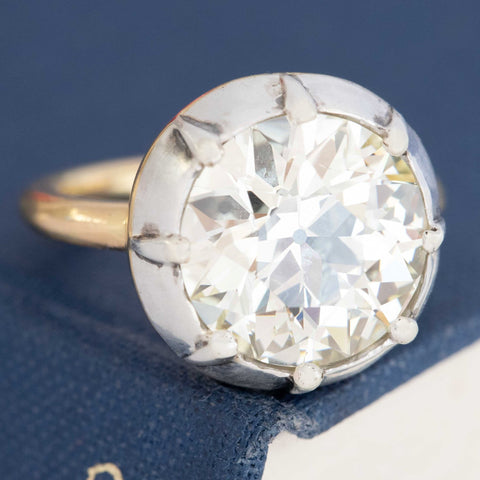A 6.42ct old European cut diamond in a vintage inspired collet setting in silver and 18kt yellow gold.  A beautiful vintage diamond and/or vintage engagement ring choice!
