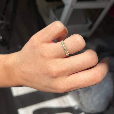 Elegant .66ctw Petite Old Mine Cut Diamond Half-Hoop Band, romantic design with Old Mine Cut Diamonds, Earth-mined diamonds in yellow gold shown on ring finger