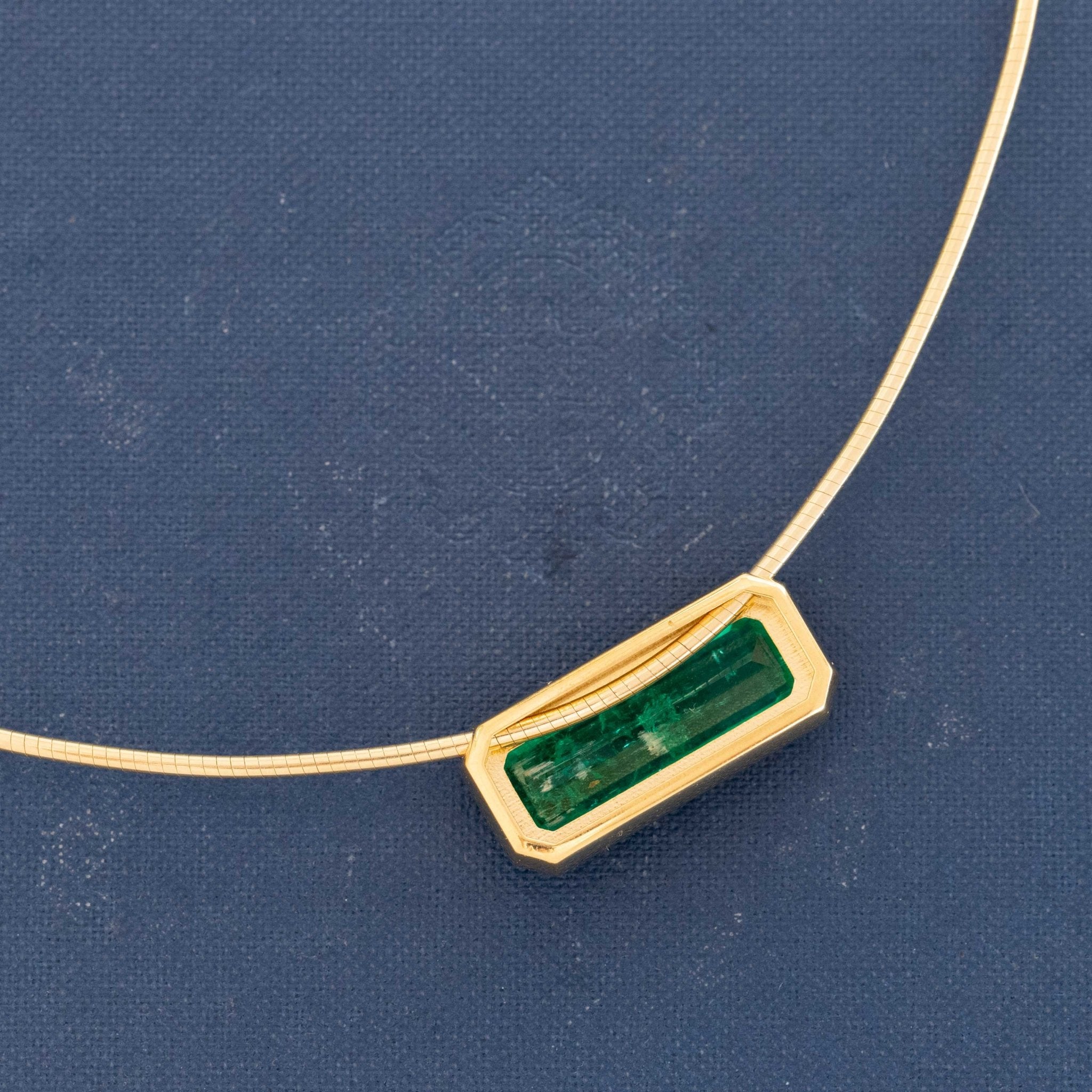 Colombian emerald gold necklace with collet bezel setting