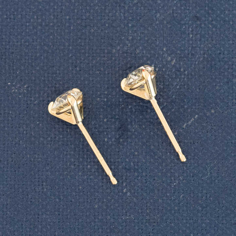 Side view of Yellow gold studs showing J/K color, VS/SI clarity old cut diamonds