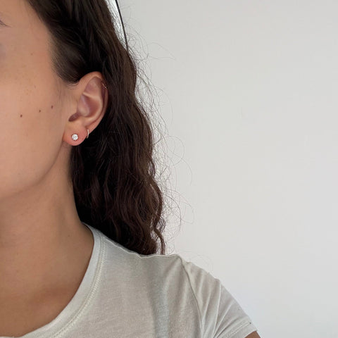 Everyday elegant vintage stud earrings with antique diamonds shown on the ears