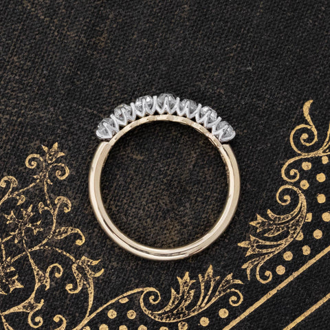 Side view of .75ctw Old Mine Cut Diamond 7-Stone Half-Hoop Band, vintage-inspired band with Old Mine Cut Diamonds, crafted with a platinum gallery and yellow gold shank