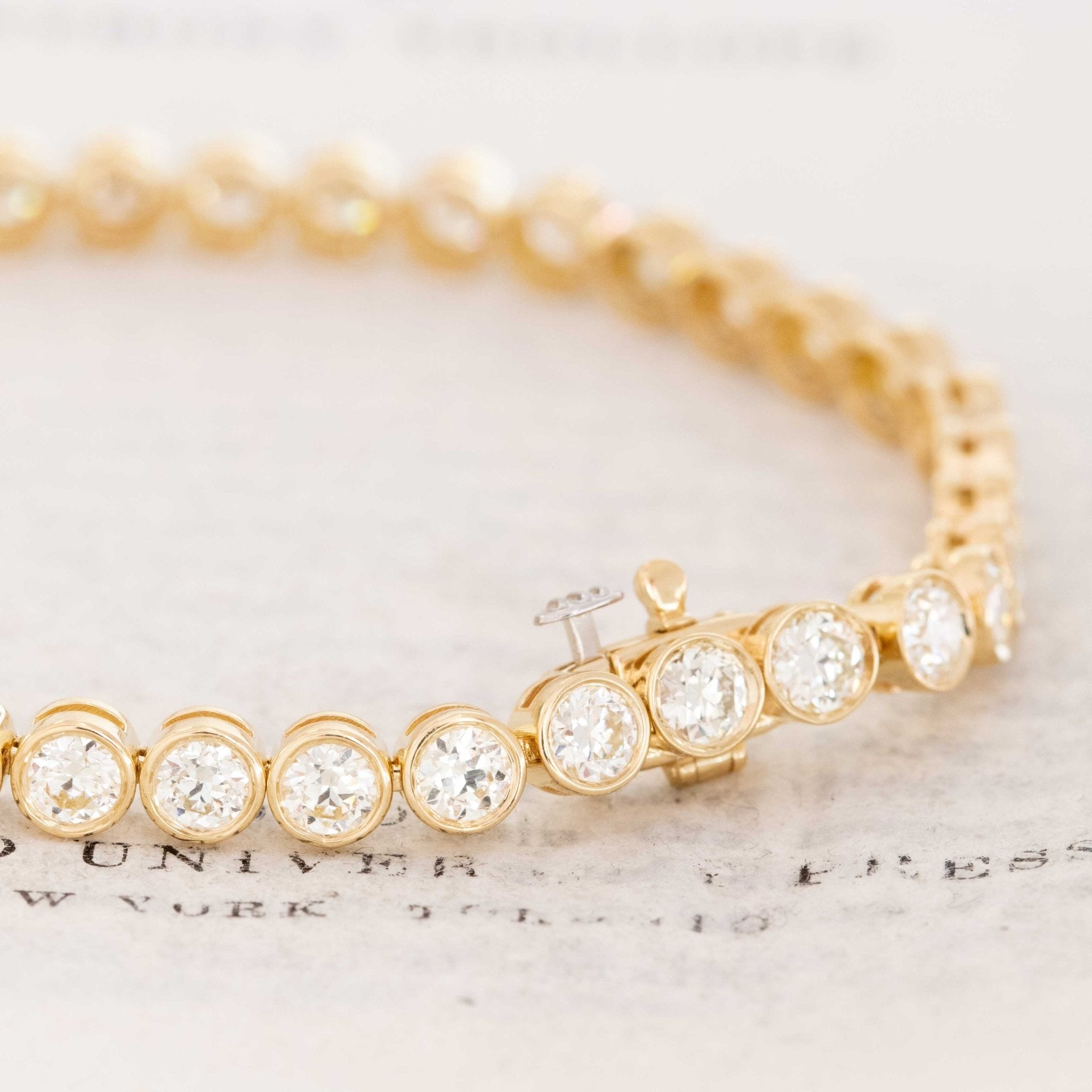 Detail of 18kt yellow gold bezels highlighting antique diamond faceting