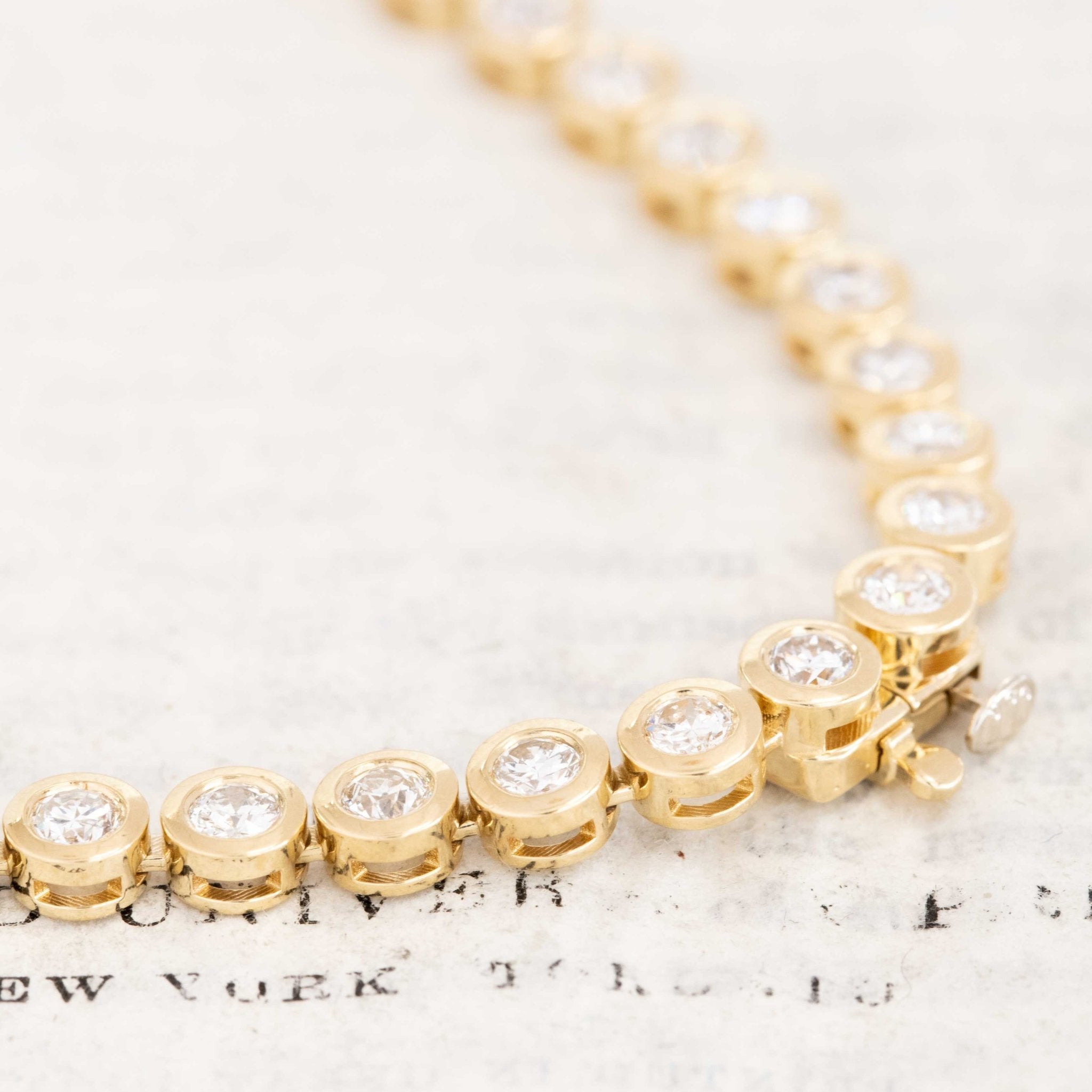 Close-up of 8.56ctw old-cut vintage diamonds set in a handcrafted 18kt Yellow gold rivière necklace made in Los Angeles.