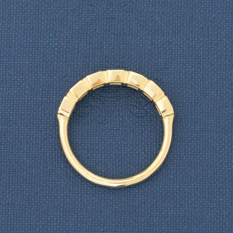 Side view of .89ctw Asscher Cut Diamond Bezel 7-Stone Band, vintage-inspired band with Antique Diamonds, crafted in yellow gold