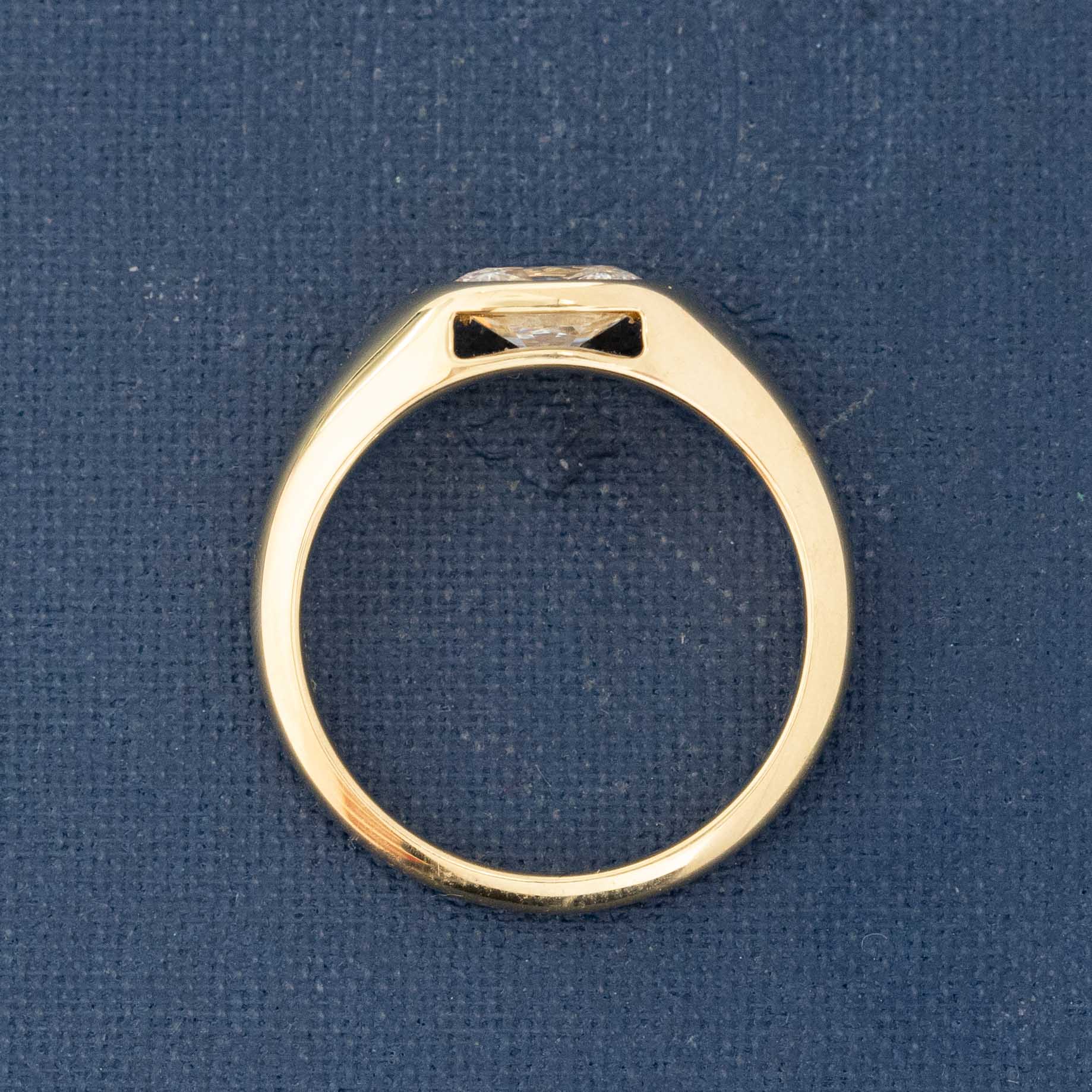 Elongated old mine cut diamond bezel ring in 18k gold