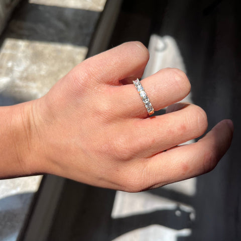 Elegant .90ctw Asscher Cut Diamond 7-Stone Band, romantic design with Antique Diamonds, Earth-mined diamonds in yellow gold shown on ring finger