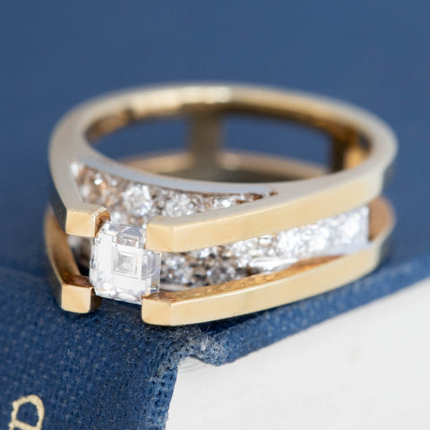 Architectural two-tone gold ring with Asscher cut center diamond