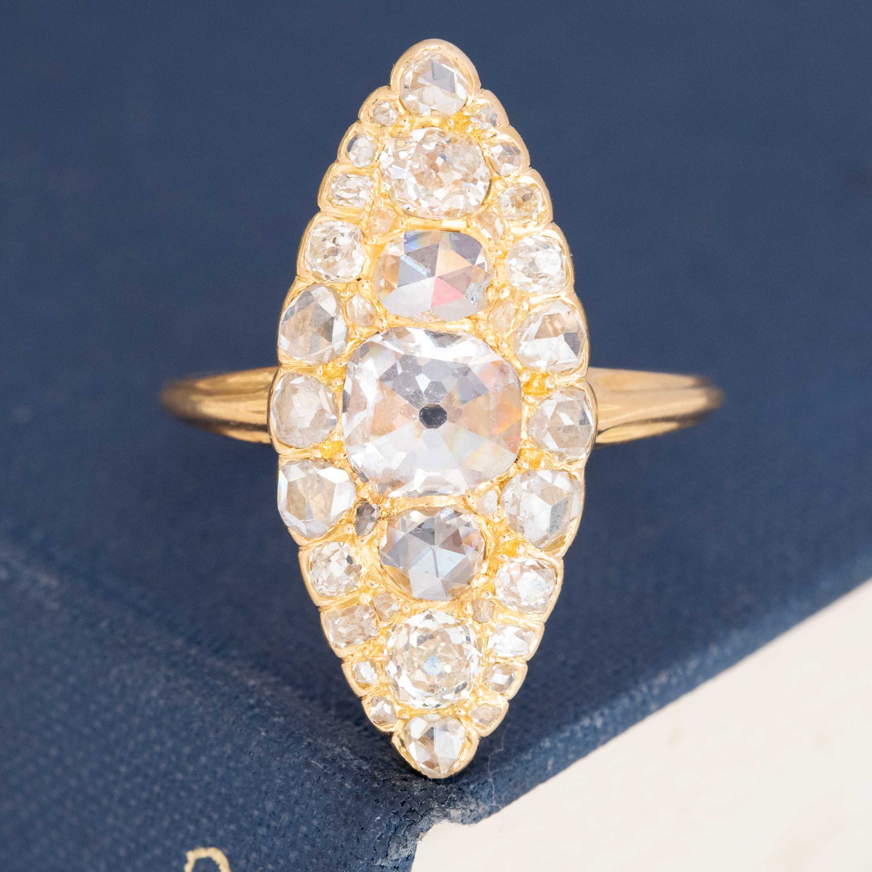 Elongated diamond navette ring featuring inverted center stone with visible culet.