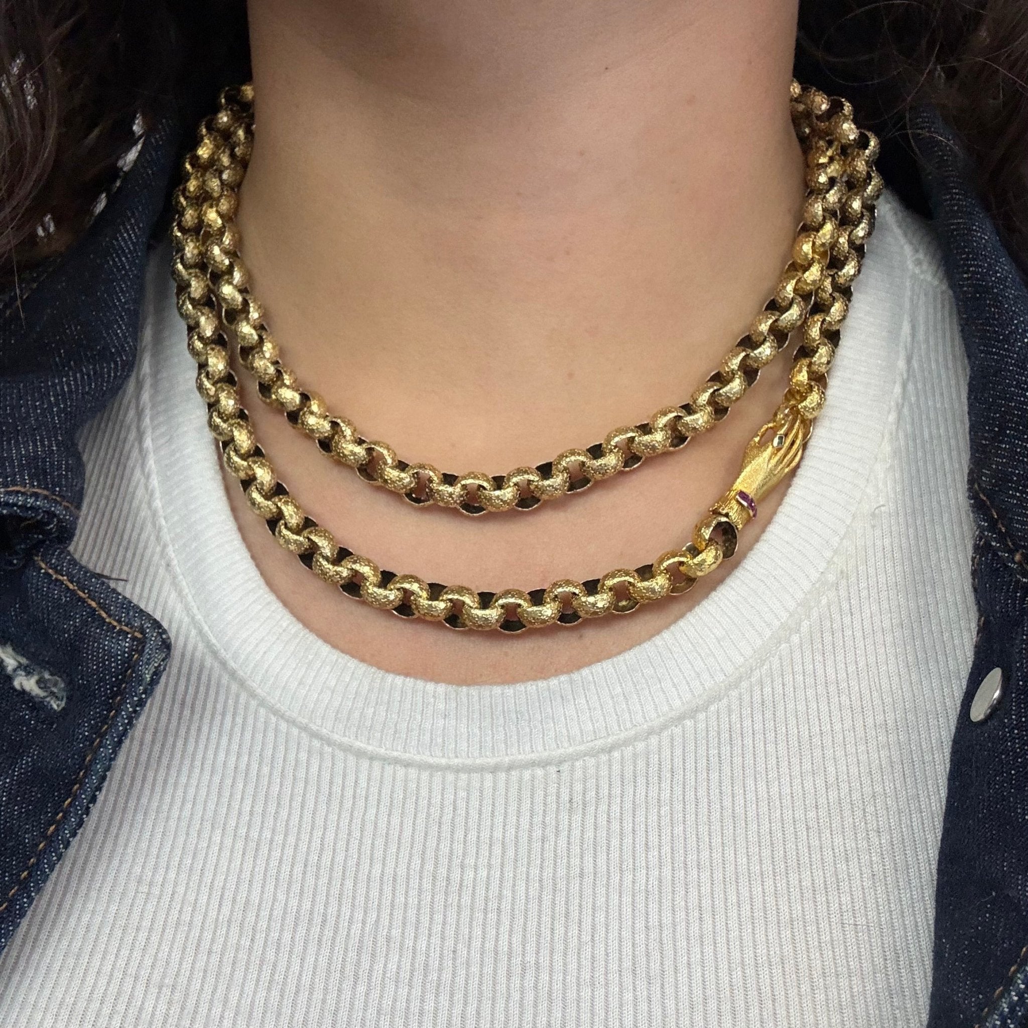 Antique long gold chain with celestial detail and symbolic hand clasp