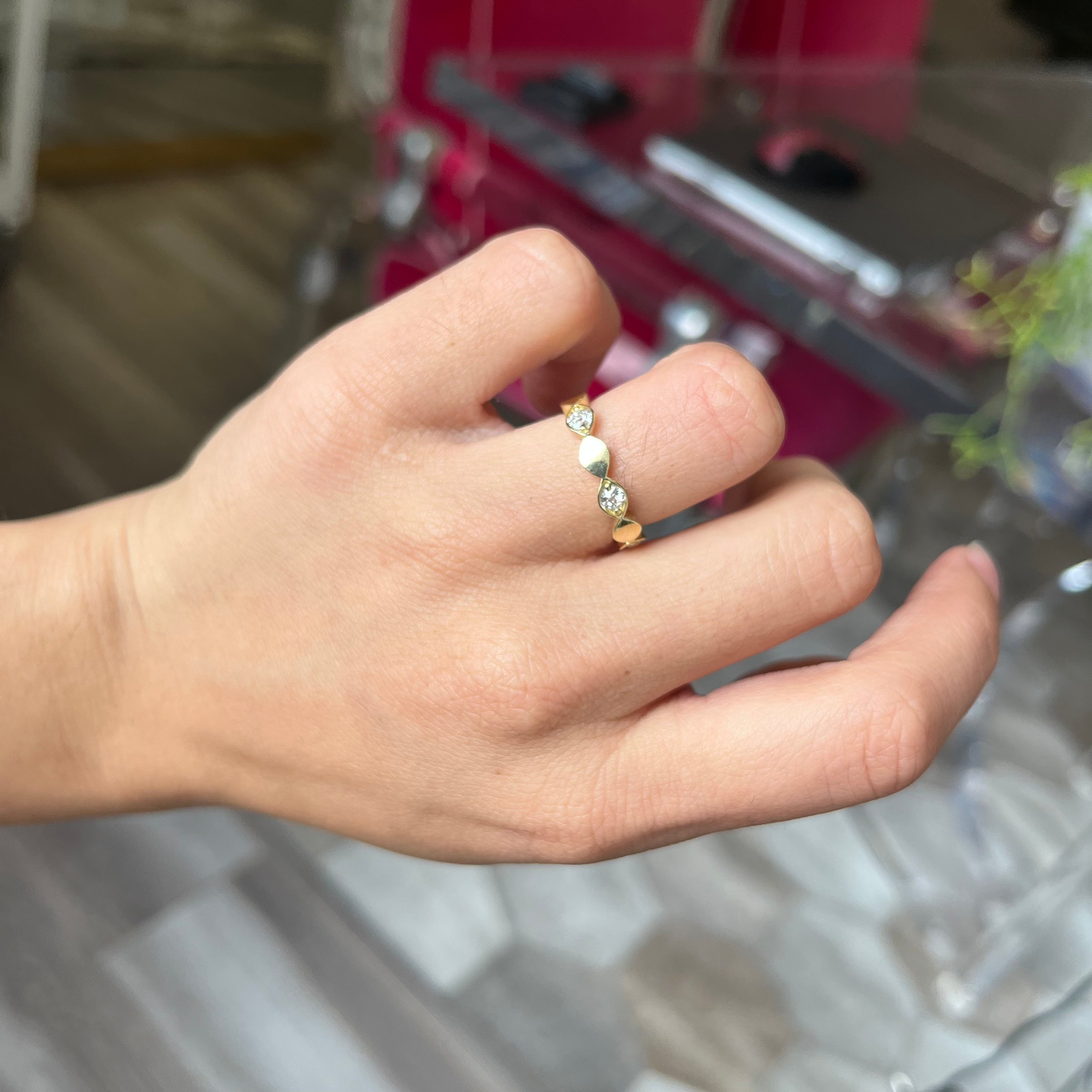Elegant .40ctw Old European Cut Diamond Navette Band, romantic design with Old European Cut Diamonds, Earth-mined diamonds in yellow gold shown on ring finger.