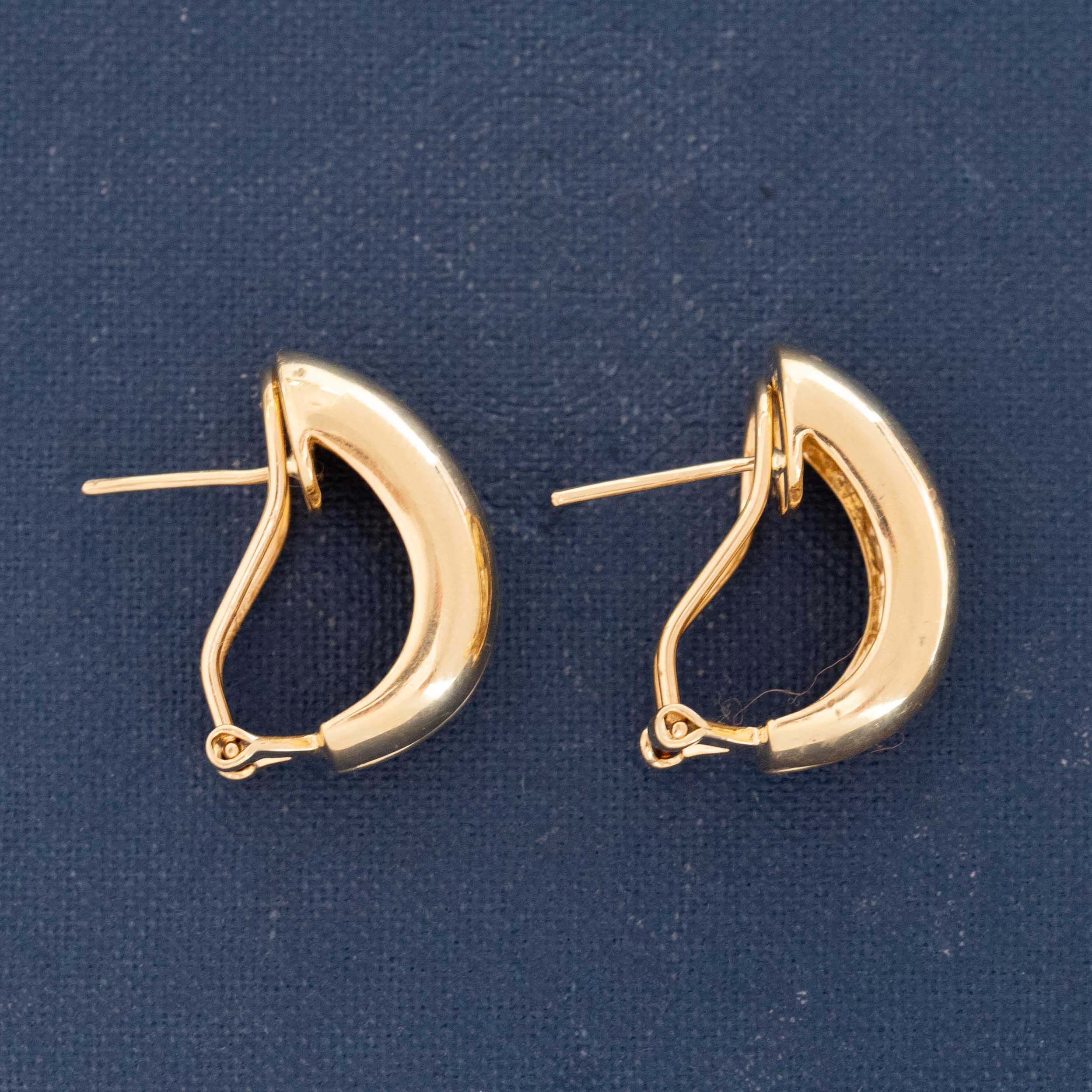 Baguette diamond half-hoops lying flat