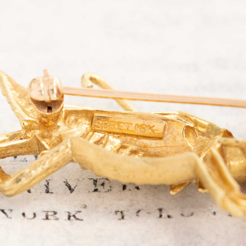 Whimsical 18K gold Jiminy Cricket lapel pin for collectors