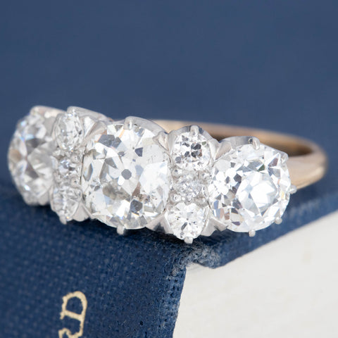 Edwardian diamond half-hoop ring with old European cut diamonds and crown-style gallery