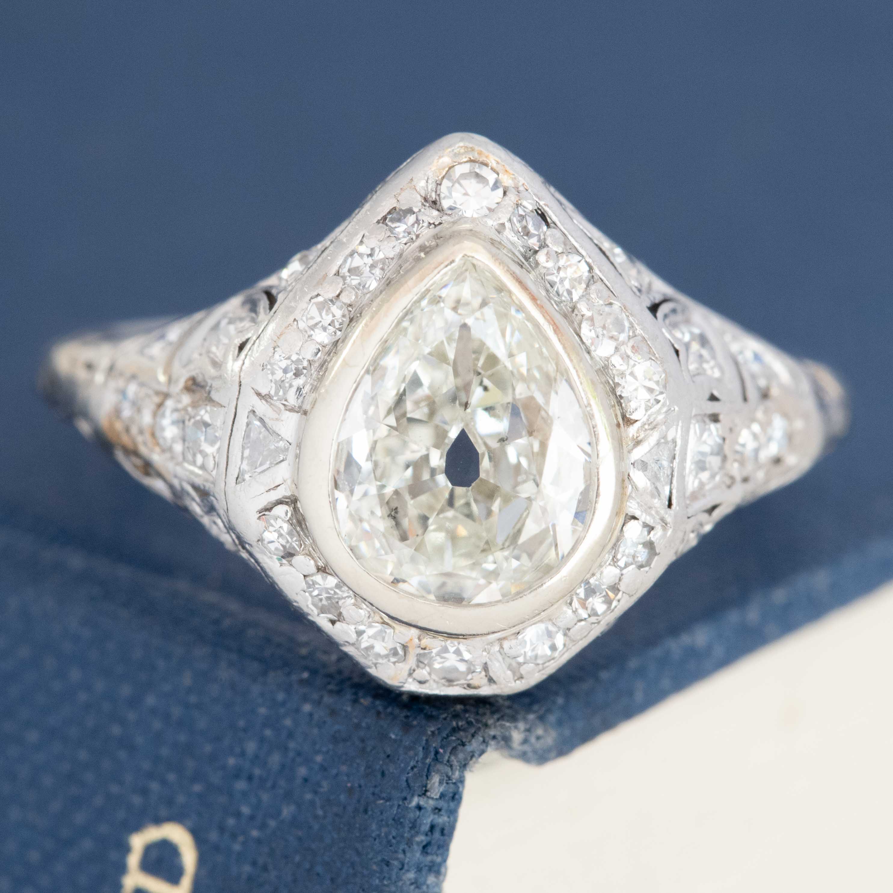 Vintage pear-shaped diamond bezel ring in platinum