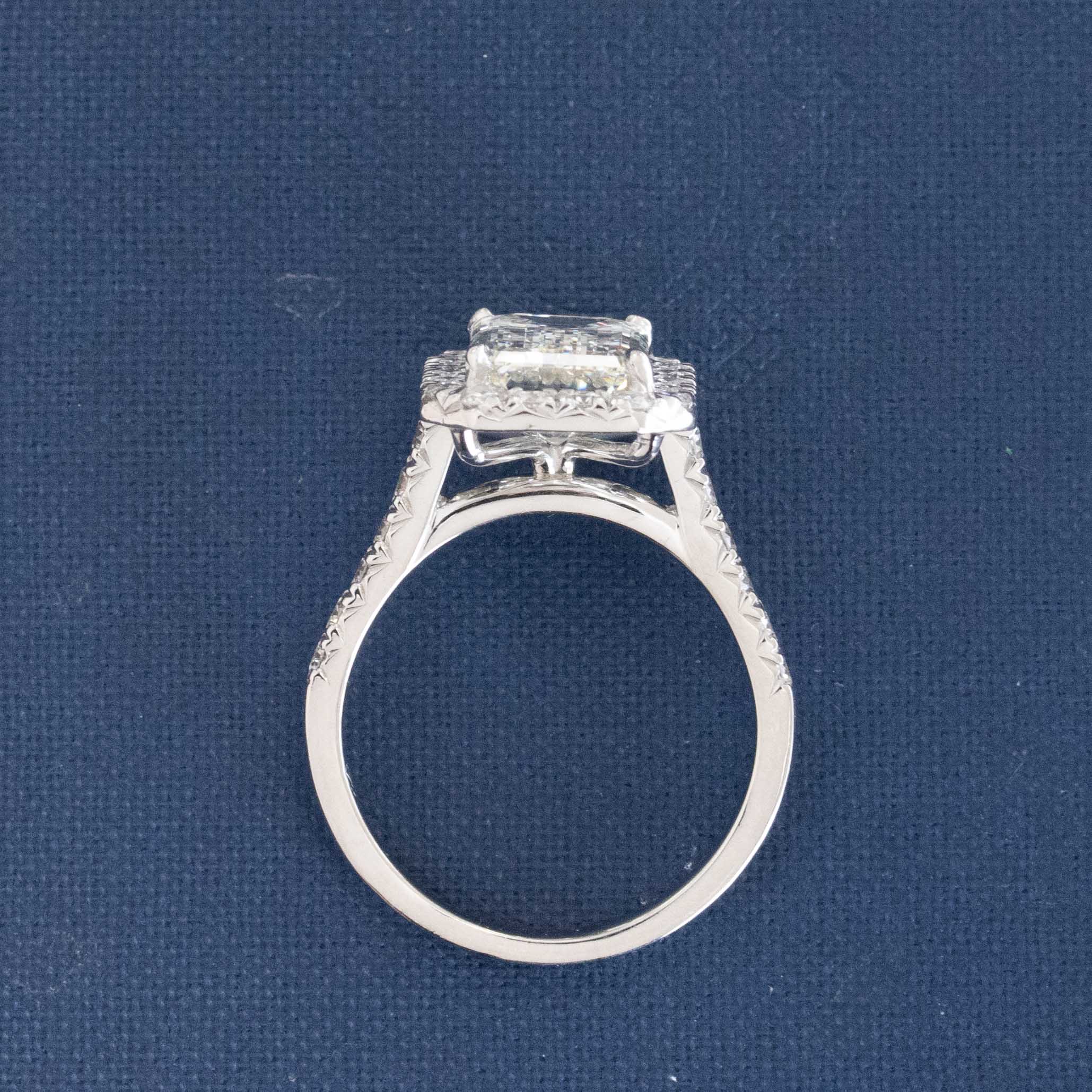 4.01CT EMERALD CUT DIAMOND HALO RING, GIA K VVS2