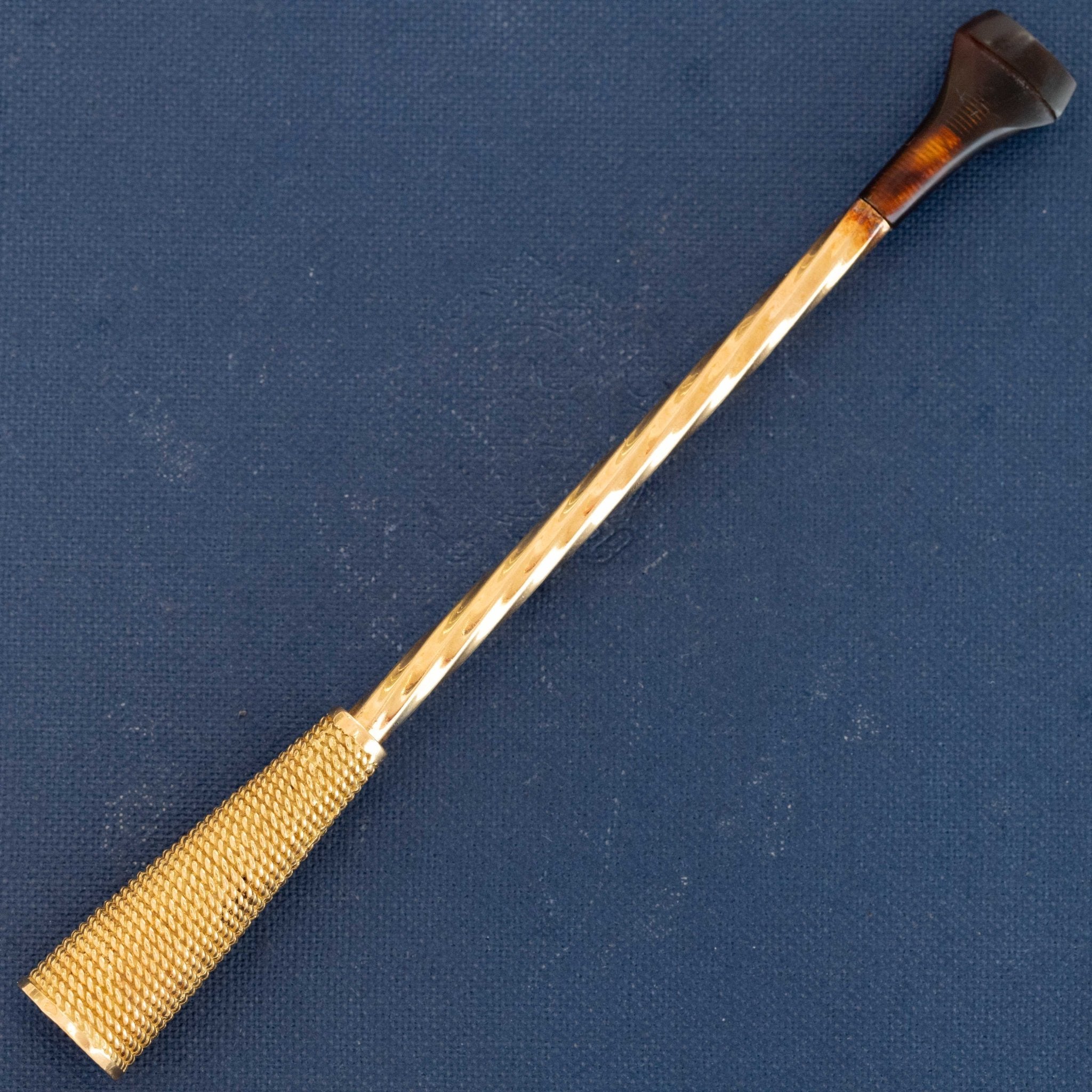 French antique gold cigar holder with engine-turned detailing and horn mouthpiece