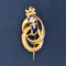 Victorian antique crowned serpent brooch in engraved gold with deep blue enamel, set with a diamond and seed pearl, symbolizing eternal love and triumph.