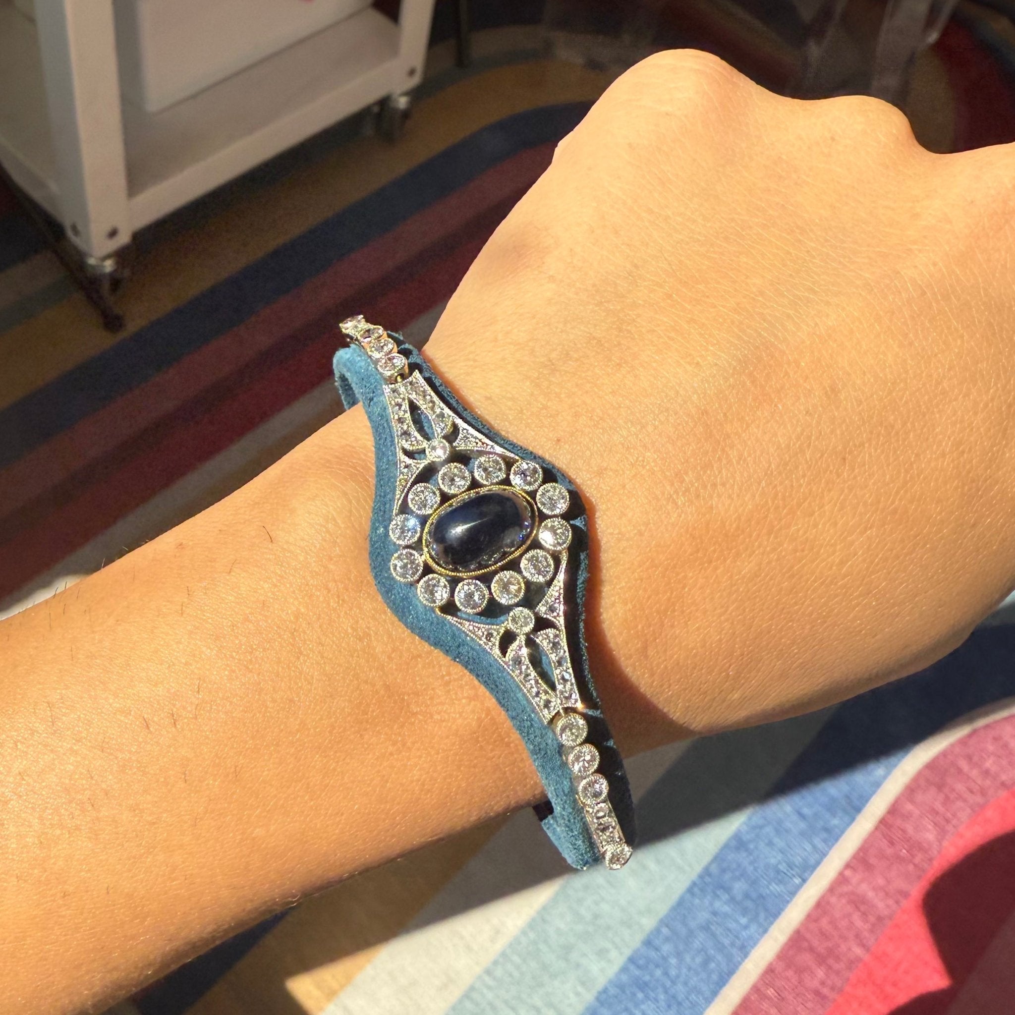 Vintage diamond and sapphire velvet bracelet close-up on wrist
