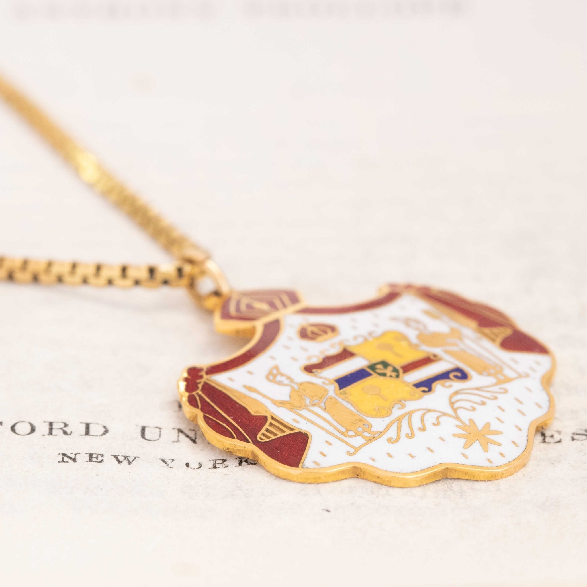 Heraldic shield pendant in 14K gold and enamel