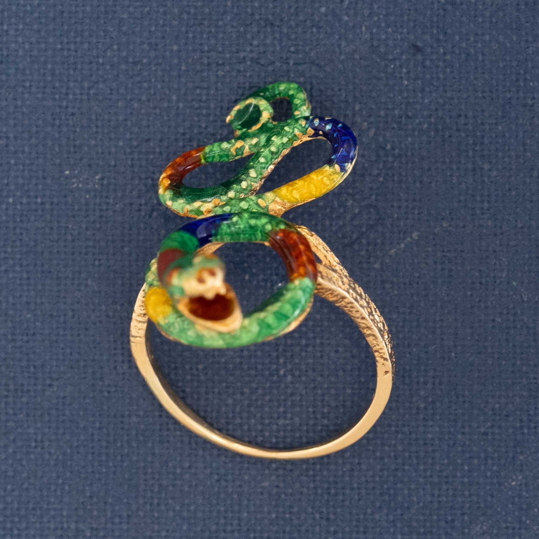 Rare antique snake ring with vibrant enamel colors symbolizing eternal love and wisdom