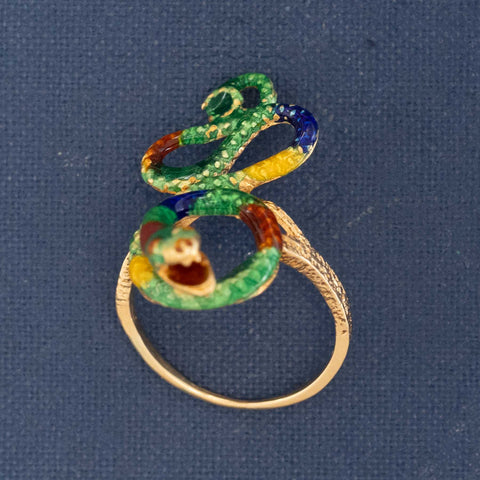 Rare antique snake ring with vibrant enamel colors symbolizing eternal love and wisdom