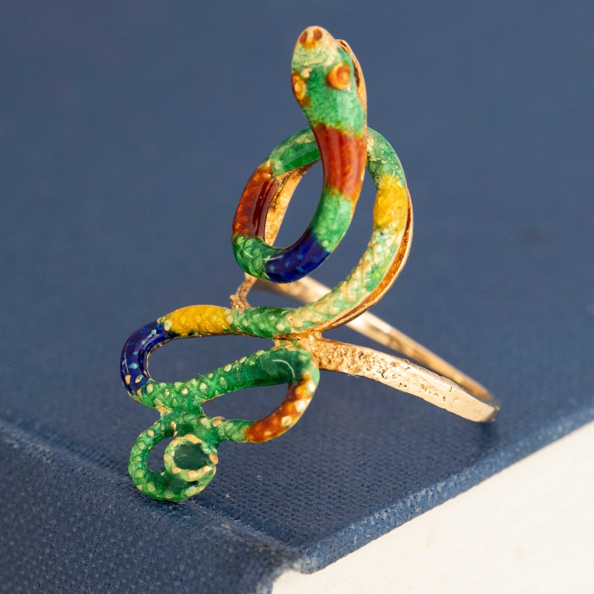 Antique enamel snake ring in colorful green, blue, red and gold vintage design