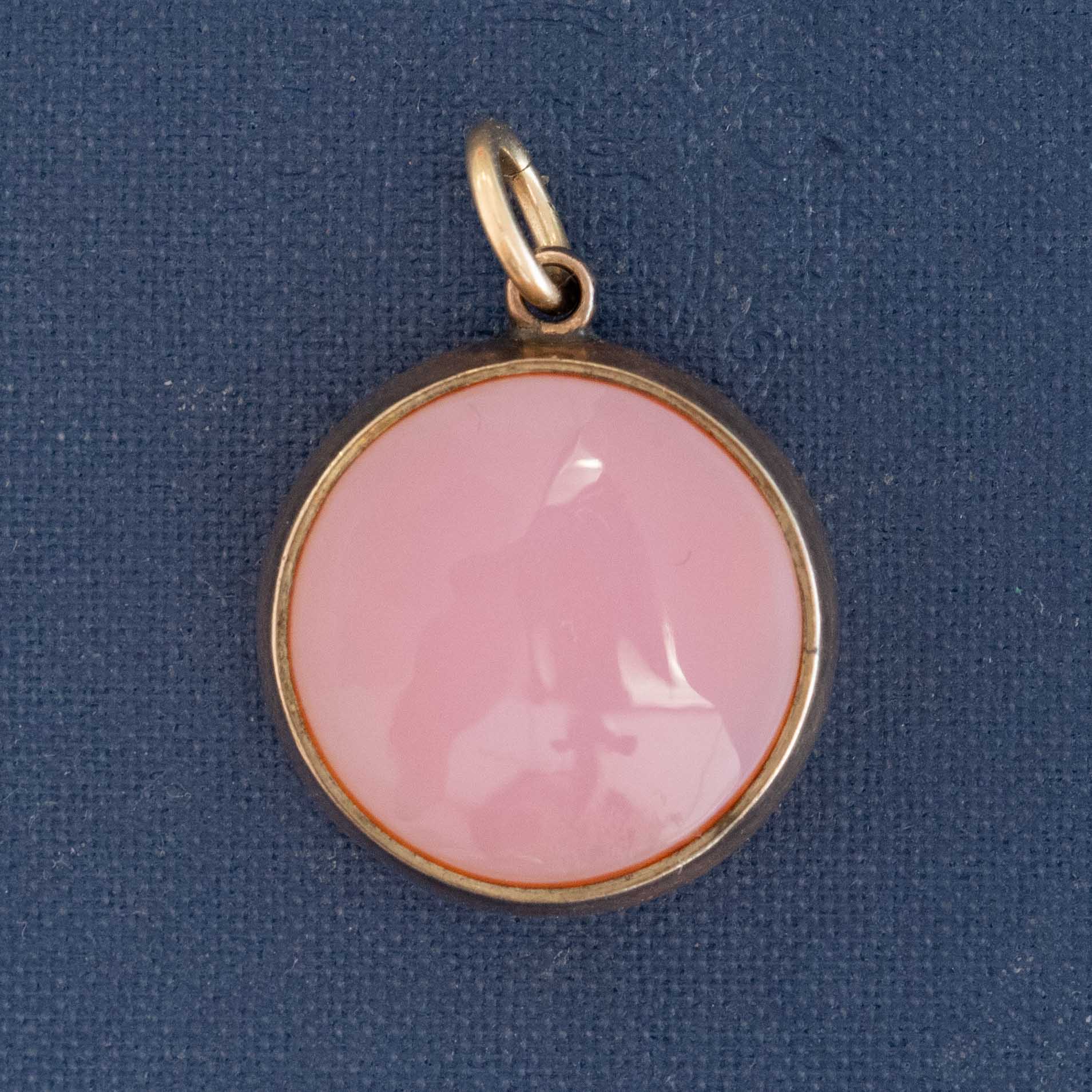 back view of antique compass pendant with movable dial showing the agate back