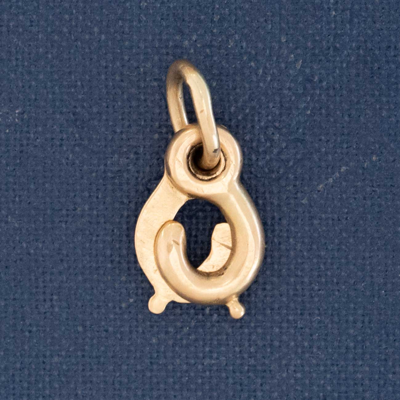 Close-up of vintage gold sister clasp, a jewelry connector from Victorian era.