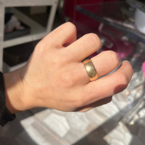 antique gold band on finger