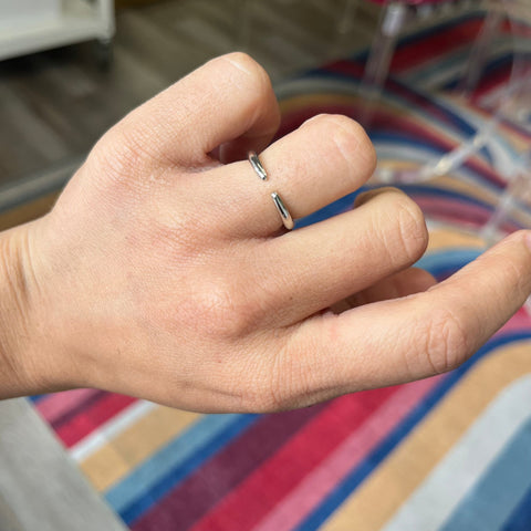 Hand shot of "Arc" Wedding Band in Platinum, vintage-inspired band  crafted in platinum
