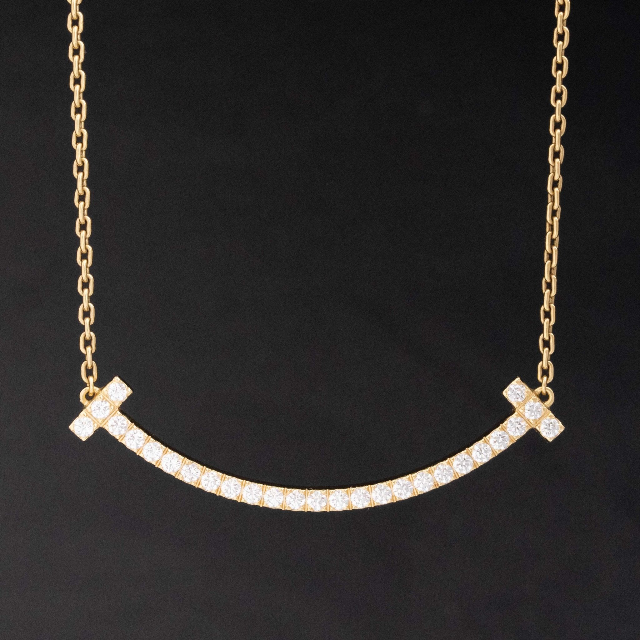 Diamond T Smile Pendant, by Tiffany & Co.