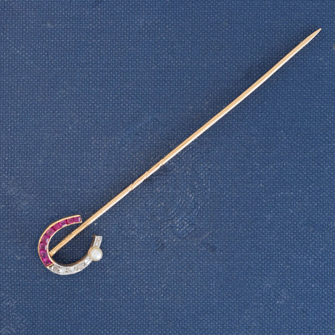 Edwardian ruby, rose cut diamond and seed pearl horseshoe stick pin in 18kt gold and platinum