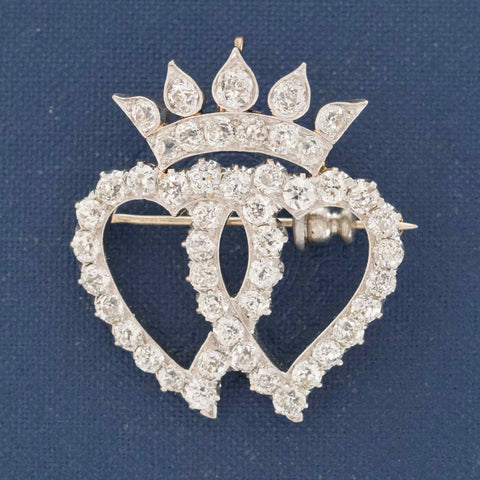 Antique Edwardian diamond double heart crown brooch in silver-topped gold
