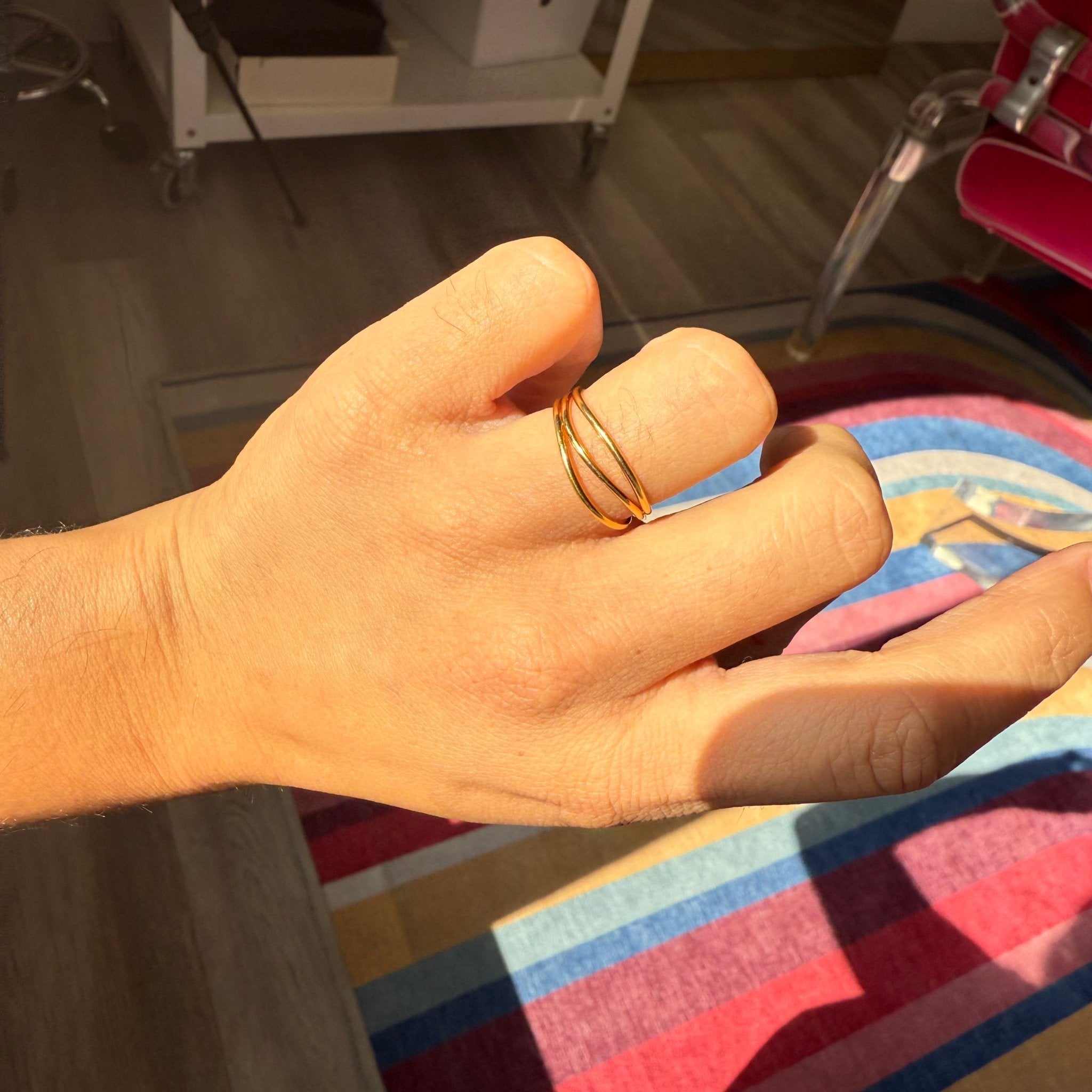 Sculptural wave band ring inspired by sea, Elsa Peretti Tiffany shown on hand
