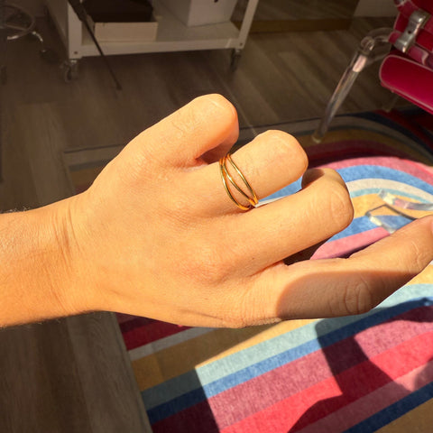 Sculptural wave band ring inspired by sea, Elsa Peretti Tiffany shown on hand
