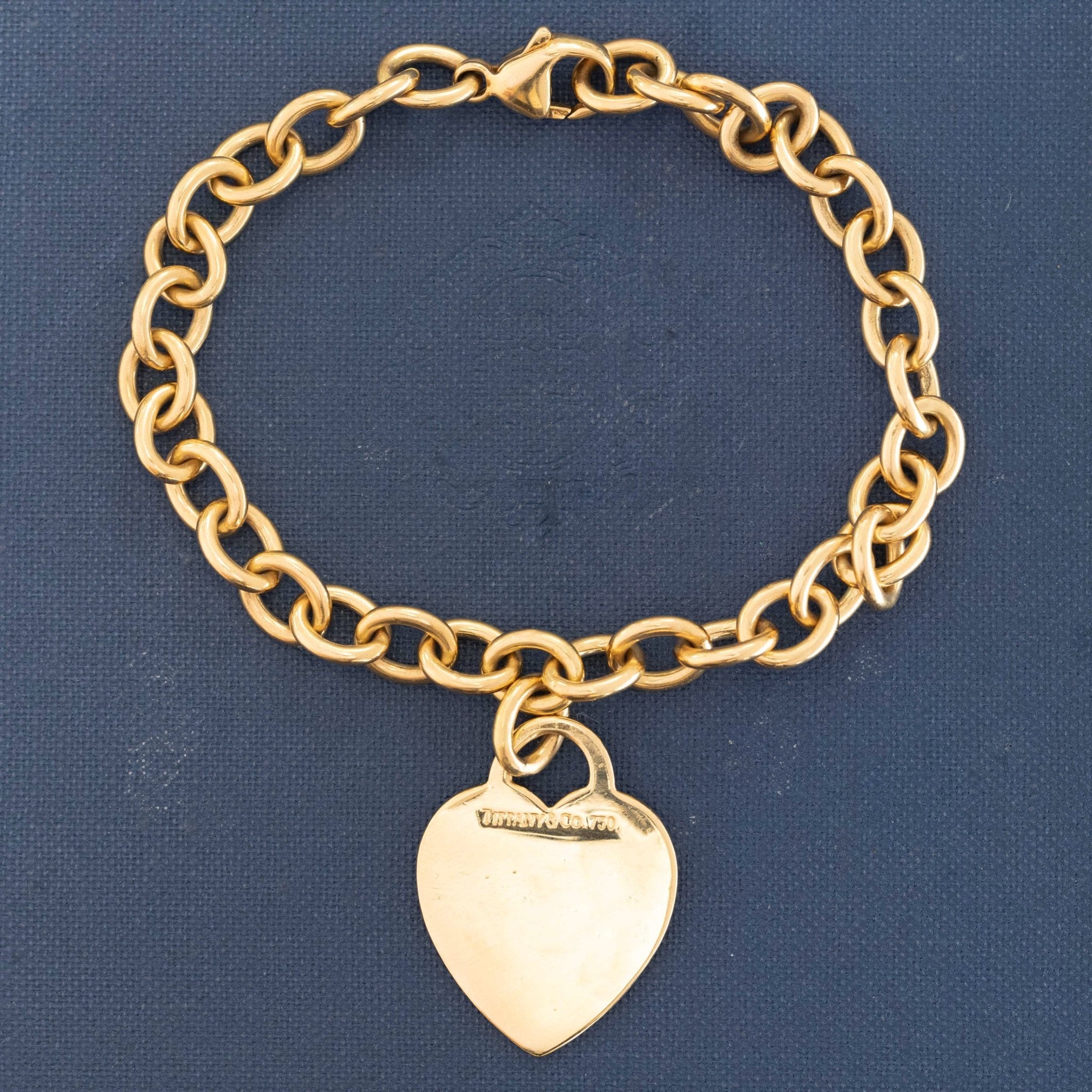 Tiffany &amp; Co. 18kt yellow gold heart tag cable link bracelet with blank tag.